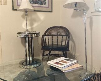 Bear coffee table and graphic art print, mirrored side table, spindle and cane back arm chair.
