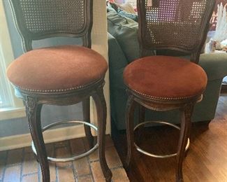 Cane-backed bar stools.
