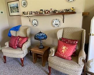 Matching wing back chairs, decorative pillows.