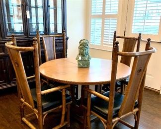 $1200- Chinoiserie Rattan table and four chairs with leaf. Table: 48 Diameter (without the leaf)27H...Chairs: 20W 41H 25D  BEAUTIFUL condition.