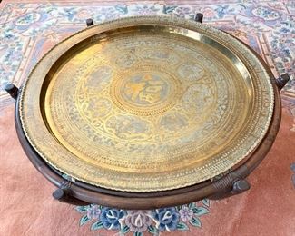 $400 - Antique Vintage Rattan Lazy Susan style (Does not spin) coffee table with etched brass Tray which features Chinese Characters, flora and fauna scenes. The pattern had several different types of Asian art work around the center of the design and script. Truly and unique Piece! 45 Diameter 17H
