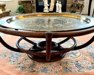 Side view of Rattan Lazy Susan Style (Non Spinning) coffee table with brass tray top.
