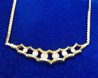 $1200. Channel set, diamond necklace. 18K Gold. 15.5 g. 6 diamonds. 16" length, end to end. 