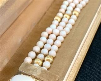 $500. Vintage Angel Skin Coral bracelet. 24g. 14k fluted beads. 14K textured prong setting around cabochon center. COA avail. 