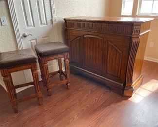 Stunning Solid Wood Bar with Upholstered Bar Stools & Brass Foot-rail.  Has keyed cabinet.   