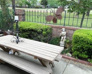 Picnic table; statue; butterfly