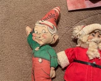 Vintage Christmas elf pillow hanging with Santa