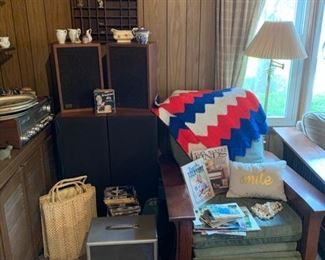 Morris style reclining chair (set of 2), vintage postcards, speakers, red white and blue crochet blanket, brass floor lamp