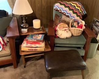 Morris style reclining chair, multi-color crochet blanket, vintage leather ottoman, brass table lamp, vintage games, vintage Santa pillows