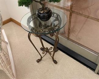 There are three of these glass-top iron tables in different sizes throughout the house.