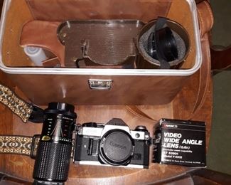 Canon AE-1 SLR camera with lens'