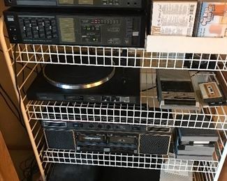 Sanyo Tuner, Turntable, Cassette Deck, Amplifier, Realistic strereo high speed dubbing cassette recorder, Magnavox 6 disc CD changer, Pioneer CD magazines,  Samsung DVD player