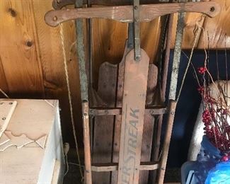 Antique Silver Streak sled and unmarked sled