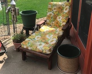 Vintage red wood chaise with wheels, garden pots