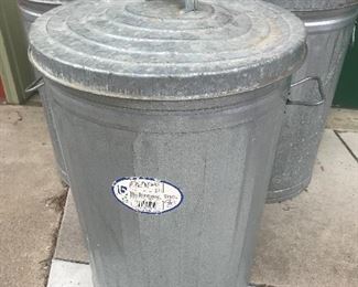 Galvanized trash cans with contents.....