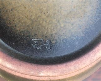 Signature on art potter vase