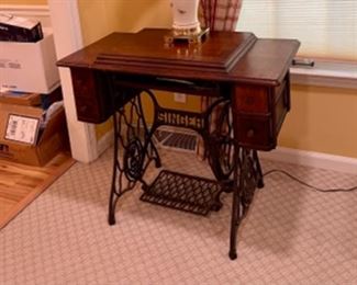 Vintage singer sewing machine in cast iron stand
