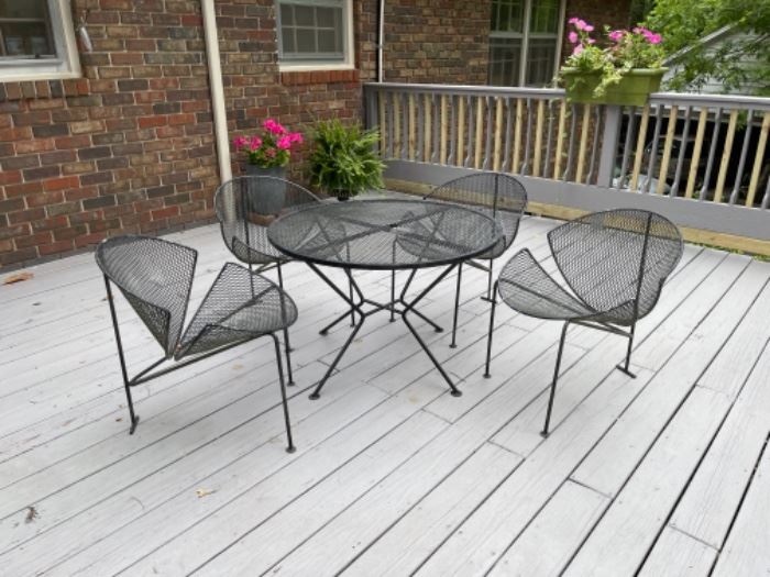Rare Mid-Century Modern Patio  Slice or Clamshell Chairs by Salterini. Table has damage where a hole was cut for an umbrella. Wrought iron. 