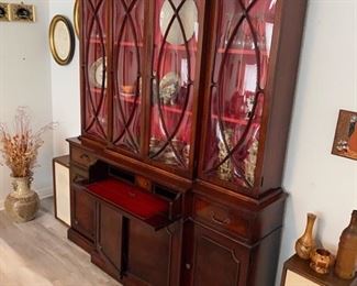 Antique cherry cupboard with convex glass and writing desk.