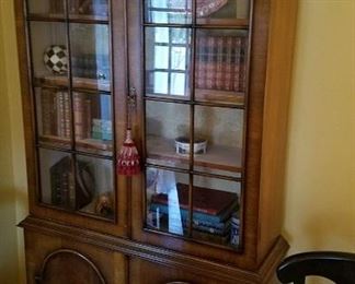 Walnut arched door divided pane transitional style library or china cabinet