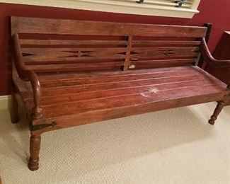 country pine plank bottom bench fret work on back, curved arm