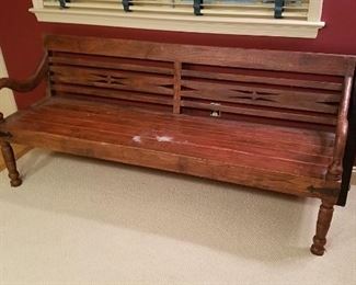 Wooden bench with arms