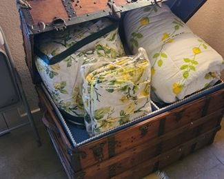 antique trunk and quilts