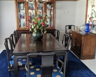 George Zee Klin Dired Mid Century Black Lacquered Dining Room Table and Eight Chairs with Blue and Gold emblem cushions .  Solid Wood Circa 1950's  Prices $4000