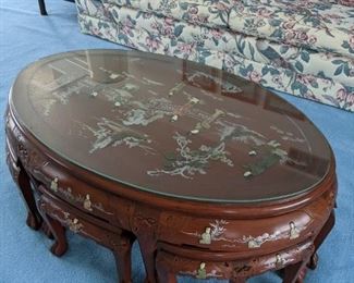 Teak/Rosewood Table with Chairs inlayed with jade and handprinted.  Foo Dog faces are carved into the legs. The glass top  for protection.  $645.00 