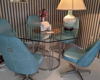 Circa 1970's glass top table with six chairs chrome finish and an inserted wood round area under the glass top very contemporary but also mid-century $ 650 