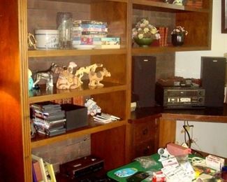 Collectibles on shelves and stereo.