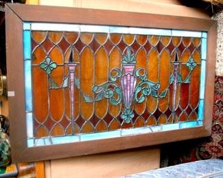 Large antique stained, leaded glass window.