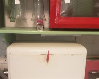 white bread box with red Bakelite opening, red small microwave (sold), elegant glass stemware