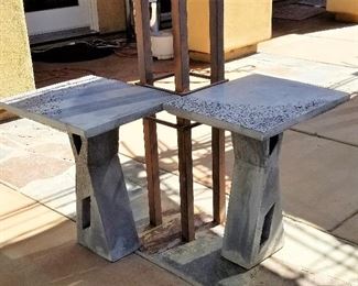 two matching cement side tables