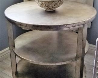 Three tiered silver round table. 