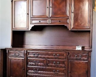 Gorgeous office furniture with writing desk pullouts on each side and lots of storage.