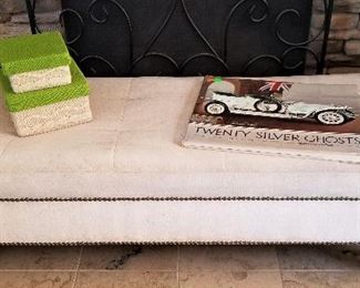 Long tufted bench. Neutral color.