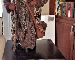 Santa Clauses for sale throughout this home. 2 matching end tables also for sale.