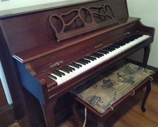 Baldwin upright piano w/ storage bench, has sheet music