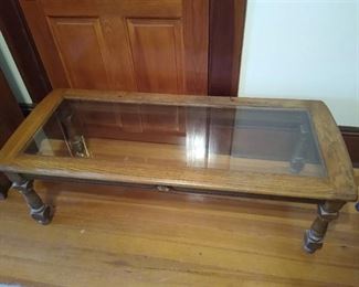 Wooden coffee table w/ glass top