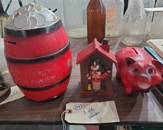 Old piggy banks.  2 are signed by maker A.N. Brooks