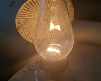 numerous antique and modern oil lamps in this auction