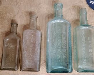 lots of old medicine bottles in this auction