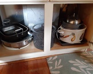 Several crock pots and small kitchen appliances