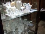 SHELVES FULL OF GLASSWARE