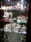 SHELVES FULL OF GLASSWARE