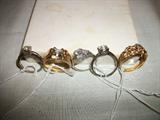PICTURES OF SEVERAL GOLD AND DIAMOND JEWELRY.