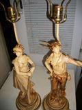 RARE 
Pair of Antique French Style L&F Moreau Metal Figural Table Lamps 
Up for sale is a Breathtaking Pair of Large Antique Metal Figural Table Lamps Marked on the bases L&F Moreau. These beautiful lamps feature a male and female figure with hand painted details and very ornate metal work. Each lamp is in nice antique/vintage condition with age appropriate paint loss here and there but overall a very stunning pair of lamps.