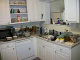 KITCHEN FULL OF DISHES AND MISC ITEMS