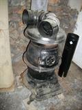 CAST IRON POT BELLY STOVE IN GARAGE # 1
